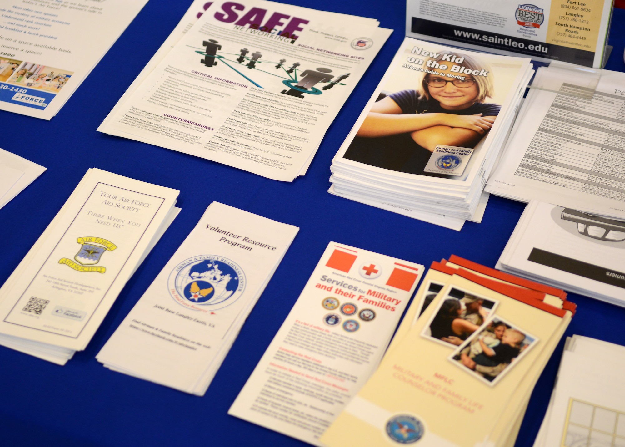 Pamphlets and fliers are displayed during a Right Start  briefing at Langley Air Force Base, Va. Jan. 20, 2015. Newly integrated Airmen at Joint Base Langley-Eustis can use the information to make important decisions for their families and home lives. (U.S. Air Force photo by Airman 1st Class Devin Scott Michaels/Released))