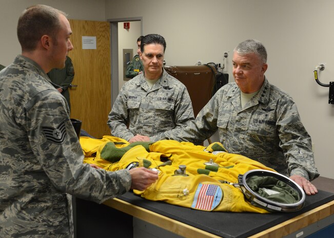 Lt. Gen. (Dr.) Thomas W. Travis (right), Air Force Surgeon General, and Brig. Gen. Sean L. Murphy, command surgeon of Air Combat Command, examine a full pressure suit during a tour of the 9th Physiological Support Squadron at Beale Air Force Base, Calif., Jan. 14, 2015. Travis oversees 75 military treatment facilities worldwide. (U.S. Air Force photo by John Schwab/Released)