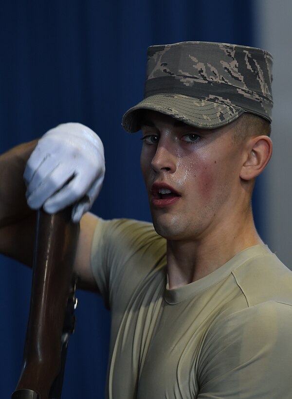 Airman 1st Class Larry Brown, United States Air Force honor guardsman, performs a weapon maneuver during USAFHG Drill Team Training at Joint Base Anacostia-Bolling, Md., Jan. 13, 2015. Six trainees volunteer eight, 60-hour weeks to learn weapon maneuvers and calisthenics to gain a spot on the team.  (U.S. Air Force photo/ Senior Airman Nesha Humes)
