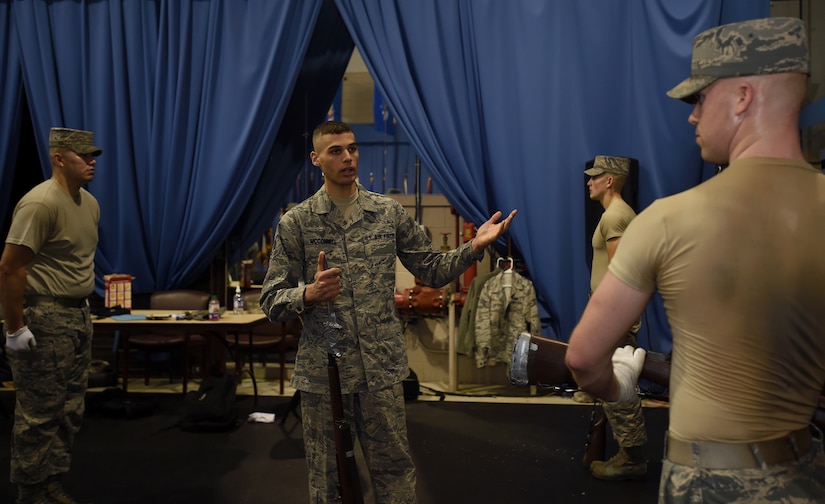 Senior Airman Korey McConnell critiques Airman 1st Class Jacob Wilson, United States Air Force honor guardsman, during United States Air Force Honor Guard Drill Team Training at Joint Base Anacostia-Bolling, Md., Jan. 13, 2015. At the end of the eight week class, trainees will have two attempts to pass final evaluations before becoming a member of the USAFHG Drill Team. (U.S. Air Force photo/ Senior Airman Nesha Humes) 