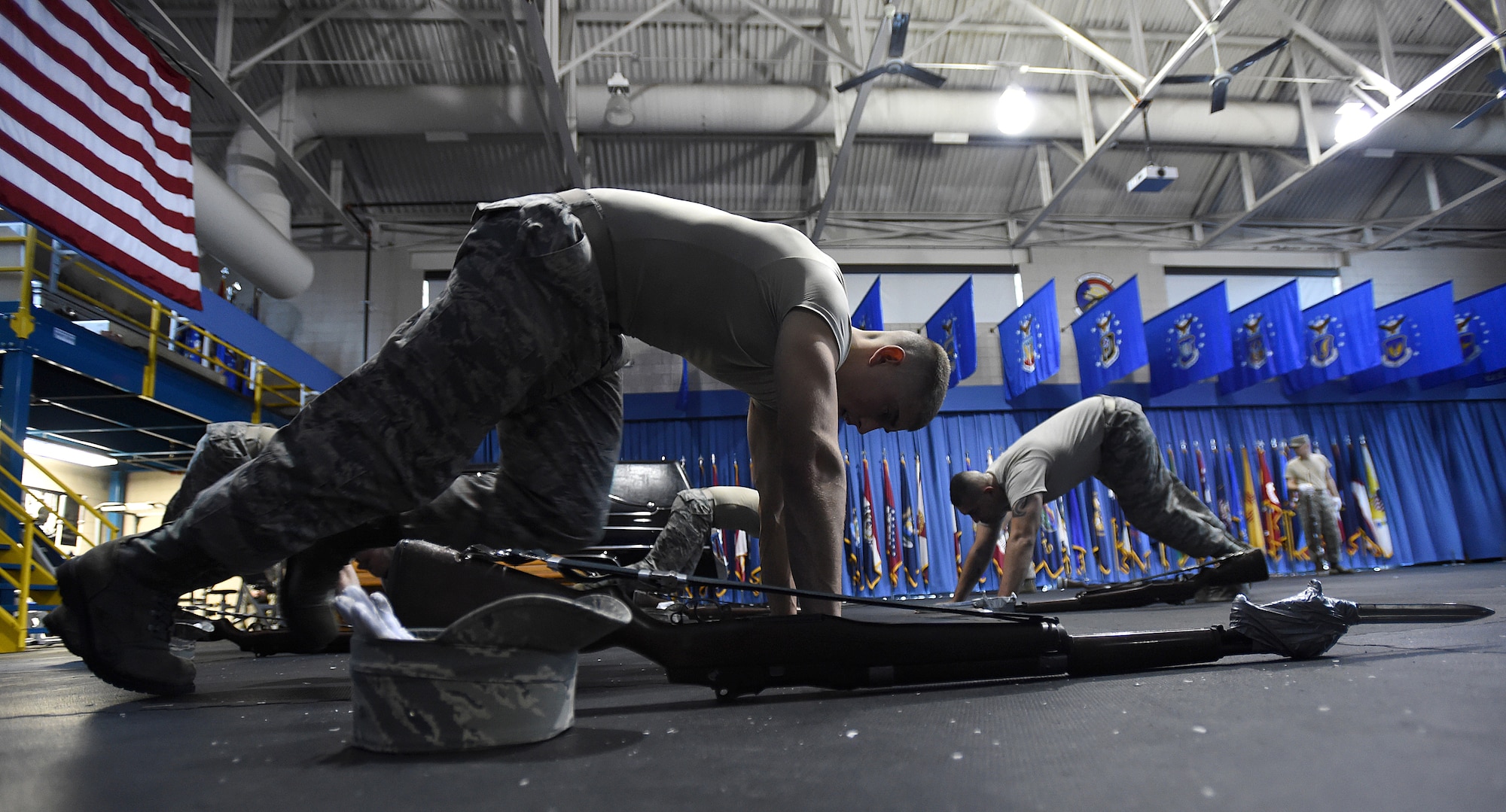 Trainees perform mountain climbers during United States Air Force Honor Guard Drill Team Training at Joint Base Anacostia-Bolling, Md., Jan. 13, 2015. Six trainees volunteer eight, 60-hour weeks to learn to learn weapon maneuvers and calisthenics to gain a spot on the team. (U.S. Air Force photo/ Senior Airman Nesha Humes) 
