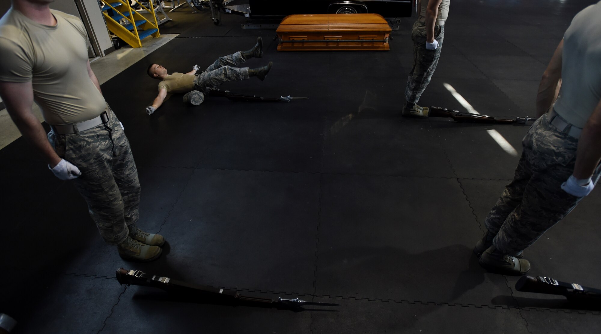 Airman 1st Class Jacob Wilson, United States Air Force honor guardsman, performs flutter kicks during USAFHG Drill Team Training at Joint Base Anacostia-Bolling, Md., Jan. 16, 2015. After a physical training session, when the drill training instructor gives an order, the last trainee to redress their gloves and cover must do extra physical training. (U.S. Air Force photo/ Senior Airman Nesha Humes)