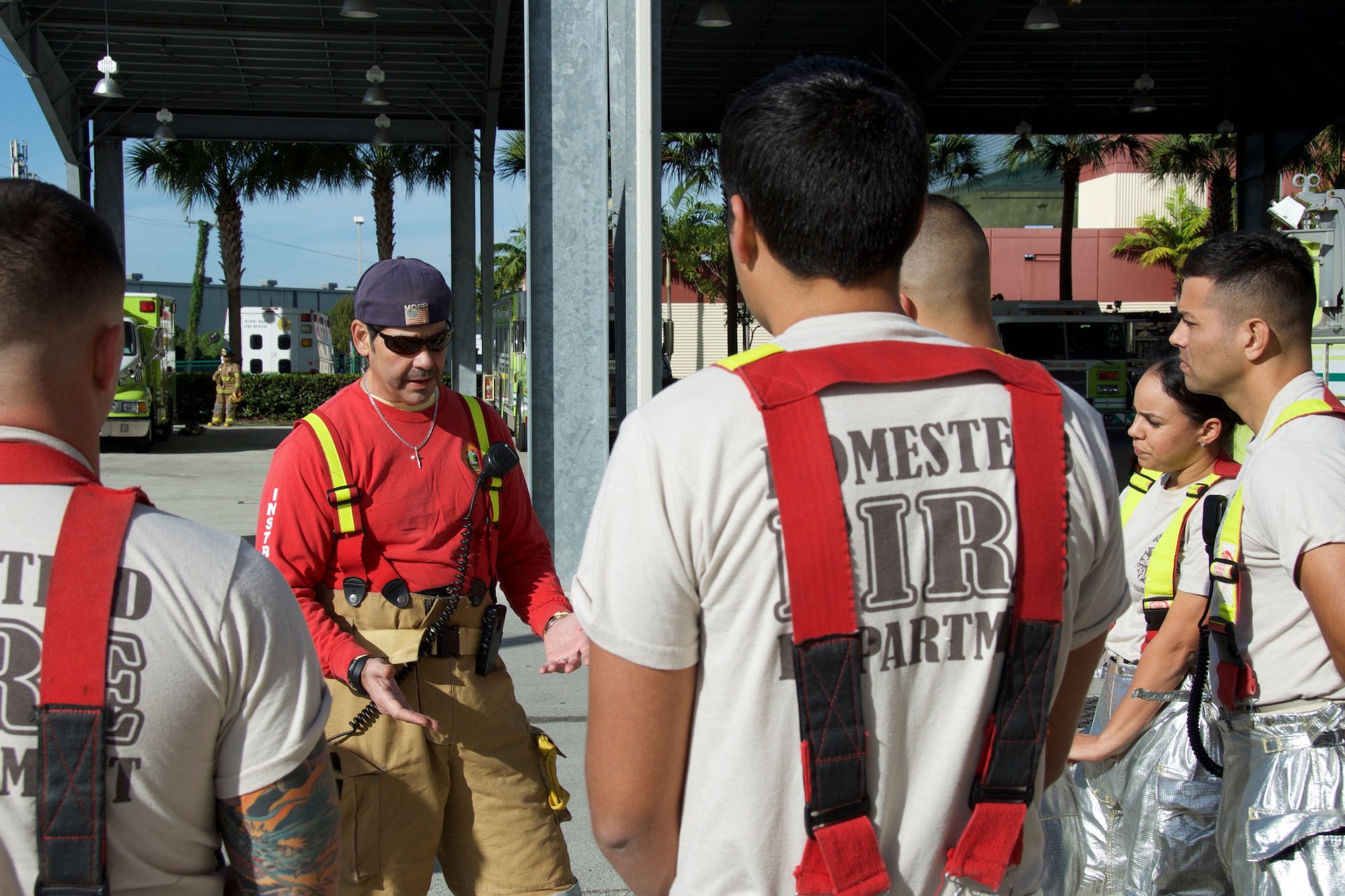 Capt. Elvin Gonzalez, Miami-Dade County fire instructor, teaches a team of reservists from the 482nd Prime BEEF (base engineer emergency force) Fire Flight, Homestead Air Reserve Base, Fla., how to utilize what‘s available to blindly navigate a building and stay oriented during a training at the Miami-Dade County Fire Rescue Training Complex in Doral, Fla., Jan. 8. The team was able to suit up and practice the teachings while instructors guided and provided insight to the importance of staying oriented. (U.S. Air Force photo by Senior Airman Jaimi L. Upthegrove)