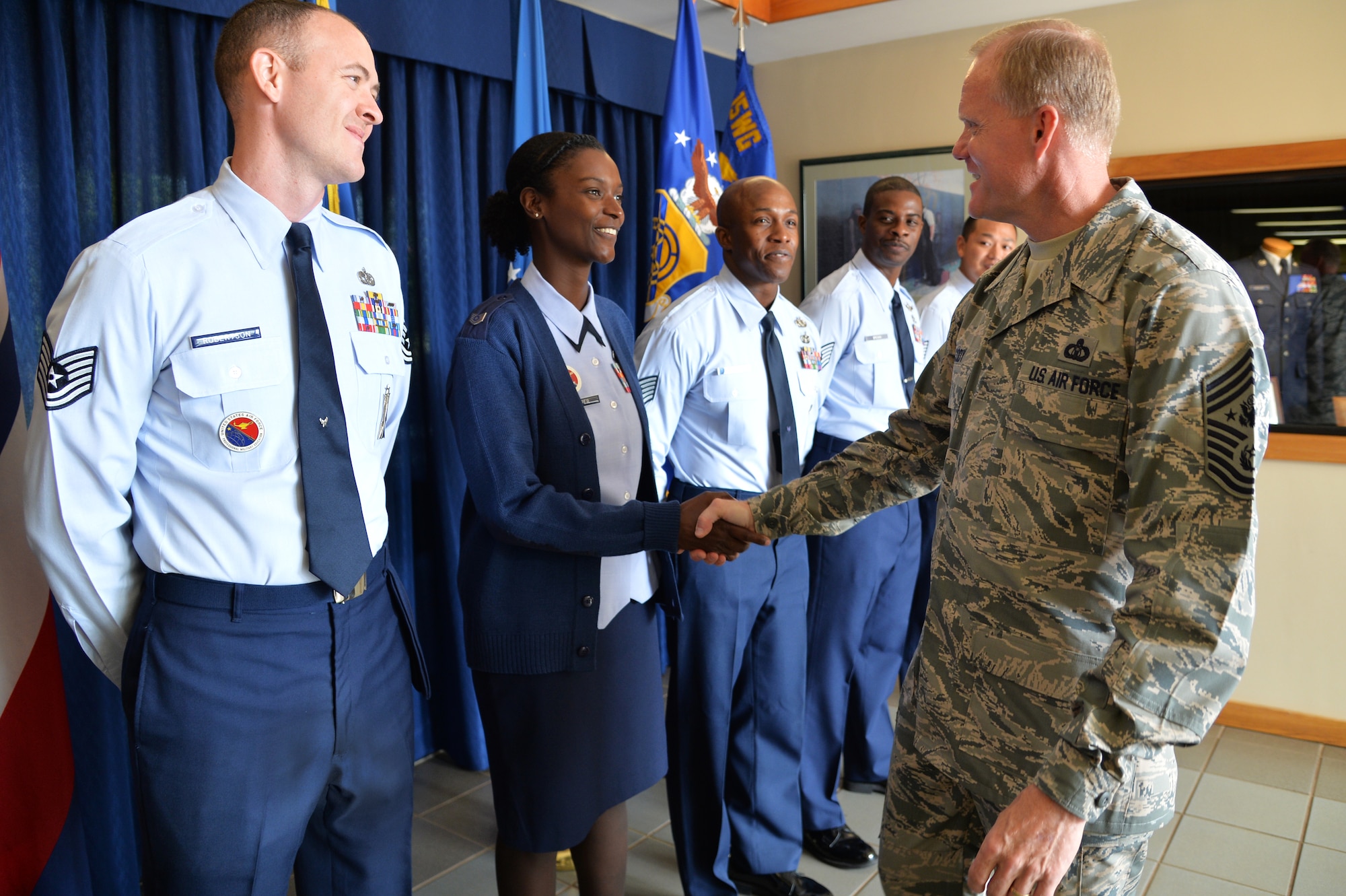 Chief Master Sgt. of the Air Force James Cody shakes hands with Tech. Sgt. Renieka Pepper, Professional Military Education instructor, during Cody’s visit to the Binnicker PME Center at Joint Base Pearl Harbor-Hickam, Hawaii, Jan. 15, 2015. Cody shared Air Force leadership knowledge during discussions with junior and senior enlisted Airmen, and met with leadership groups and Airmen in their work areas during his two-day visit. (U.S. Air Force photo by Staff Sgt. Alexander Martinez)