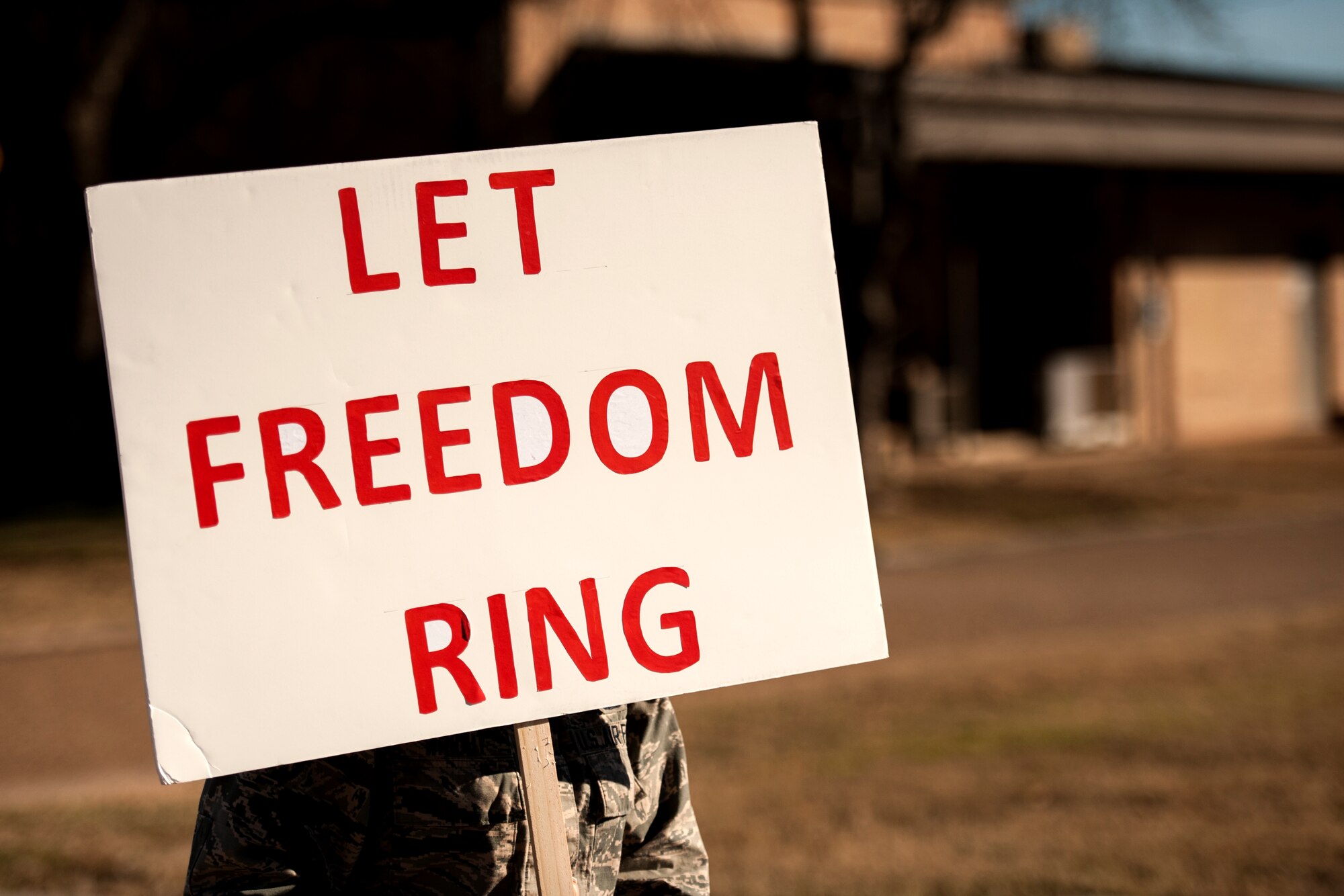 GOODFELLOW AIR FORCE BASE, Texas – Airman 1st Class Stacia S. Wright, Wing Executive Support Staff administration, carries a sign during The March on Goodfellow Air Force Base, Jan. 16. The march celebrated the legacy of Martin Luther King Jr. (U.S. Air Force photo/ Airman 1st Class Scott Jackson)