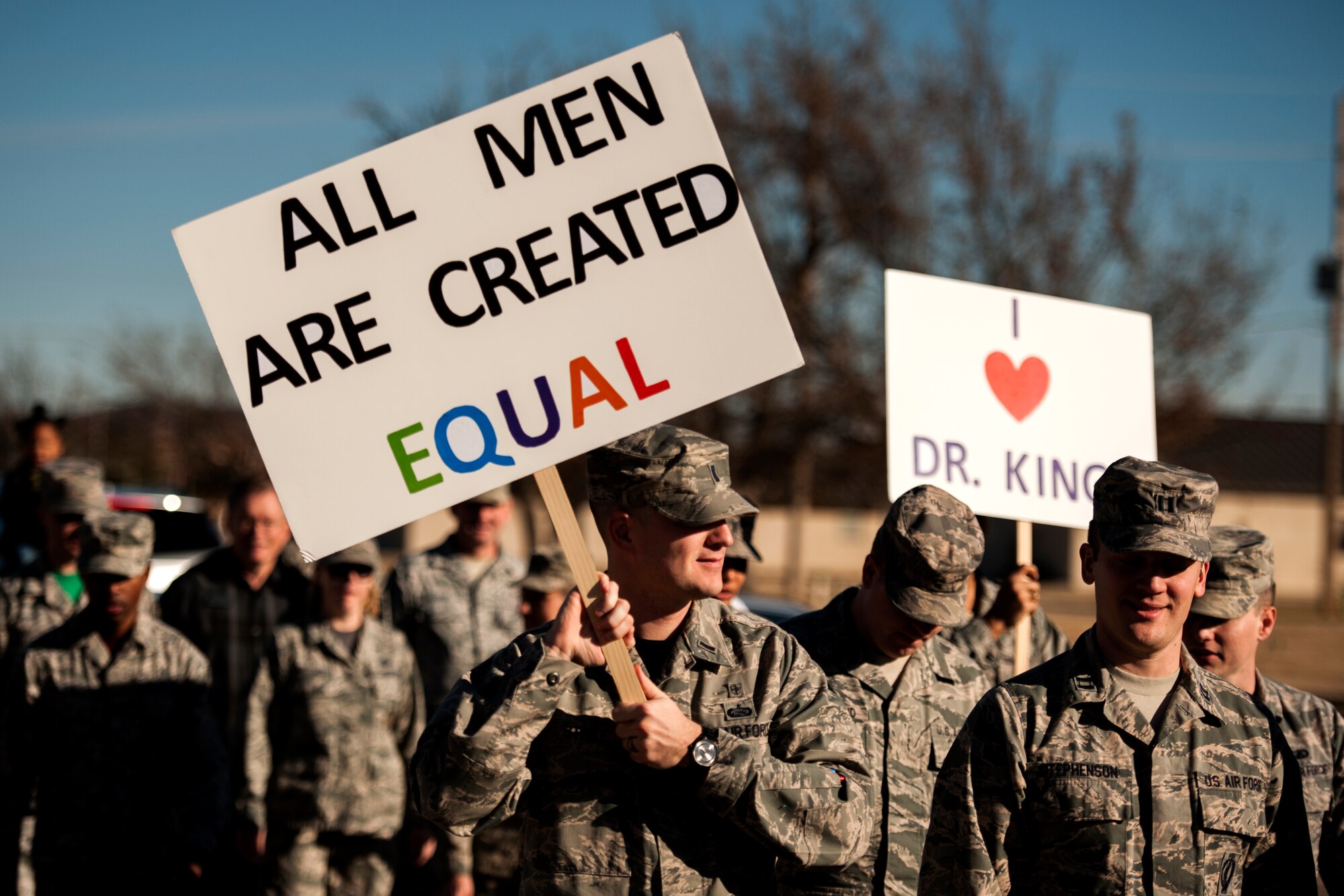 GOODFELLOW AIR FORCE BASE, Texas – Team Goodfellow members carry signs during The March on Goodfellow Air Force Base, Jan. 16. Members from all the service branches came out to celebrate the legacy of Martin Luther King Jr. (U.S. Air Force photo/ Airman 1st Class Scott Jackson)