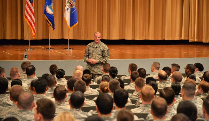 Chief Master Sgt. of the Air Force James Cody speaks with Airmen during an all-call in Memorial Theater at Joint Base Pearl Harbor-Hickam, Hawaii, Jan. 15, 2015. Cody shared Air Force leadership knowledge during discussions with junior and senior enlisted Airmen, and met with leadership groups and Airmen in their work areas during his two-day visit. (U.S. Air Force photo by Staff Sgt. Alexander Martinez) 