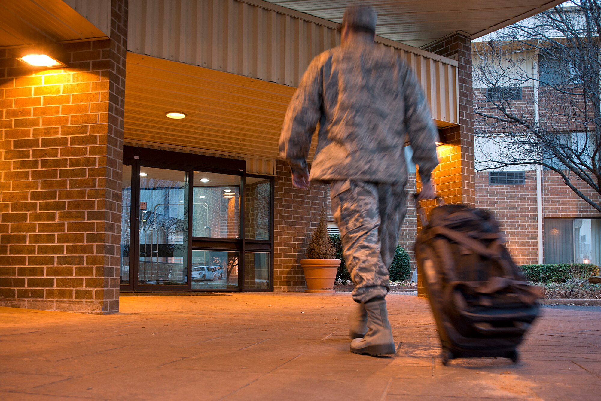 A member of the 137th Air Refueling Wing checks into a hotel near Will Rogers Air National Guard Base. (U.S. Air National Guard photo by Master Sgt. Andrew LaMoreaux/Released)