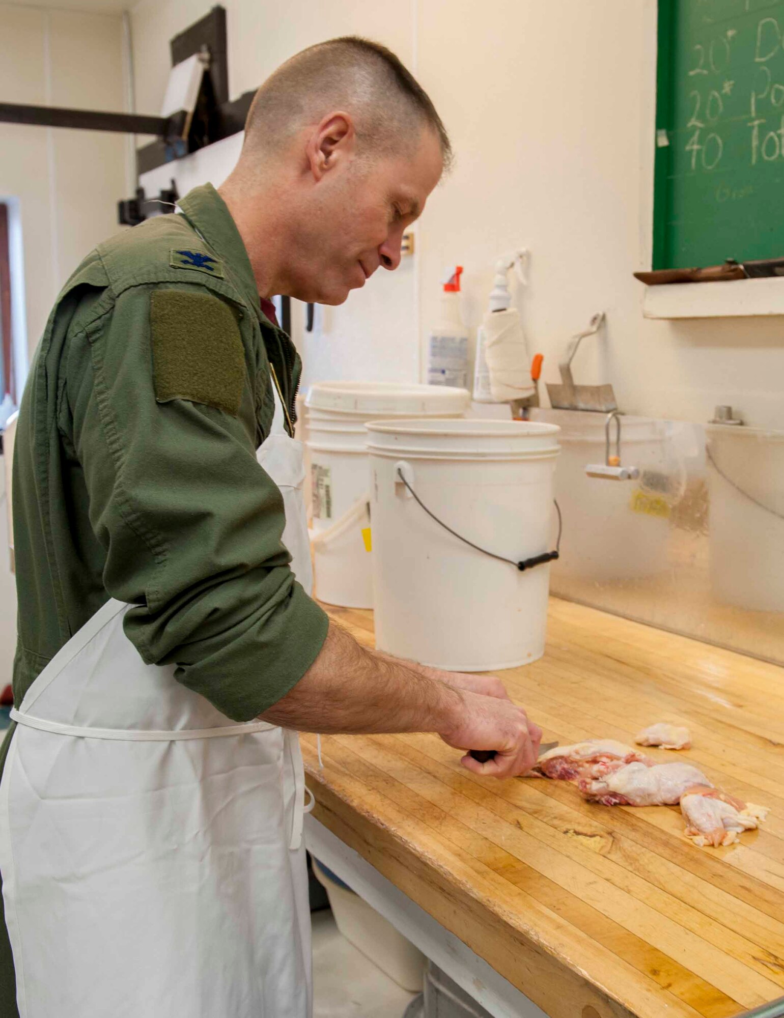 Col. Michael Lutton, 91st Missile Wing commander, slices duck in Minot, N.D., Jan. 16, 2014. Duck was one of the many entrees served during the 50th annual Sportsmen’s Feed along with other game such as pheasant, wild turkey, venison and bison. (U.S. Air Force photo/Airman 1st Class Sahara L. Fales)