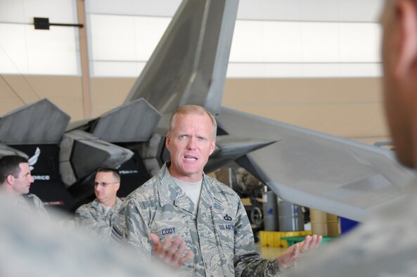 Chief Master Sgt. of the Air Force James Cody speaks with airmen at the Daniel K. Inouye F22 Fighter Squadron Ops and Maintenance facility, Joint Base Pearl Harbor-Hickam, Hawaii Jan. 16, 2015. The Hawaii based raptor squadron is a Total Force Integration, or TFI unit comprised of airmen from the Hawaii Air National Guard 154th wing and the active duty 15th wing. Cody spoke about the future of TFI in the Air Force. (U.S. Air Force photo/Senior Airman Orlando Corpuz)