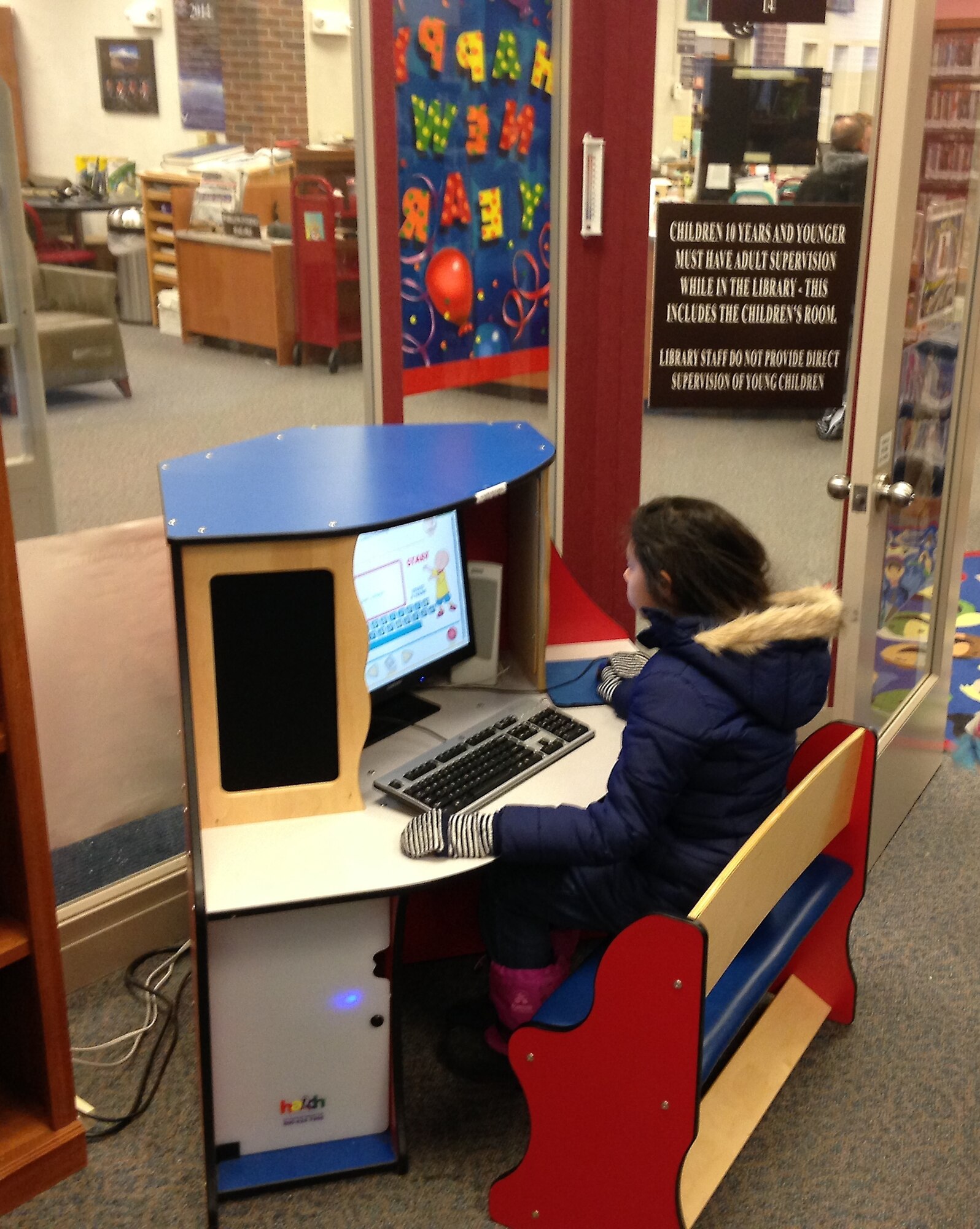 PETERSON AIR FORCE BASE, Colo. -- Yasemin Revira, 10, uses an educational computer station in the children's room at the Peterson library on a recent visit to the facility with her family. (U.S. Air Force photo by Dave Smith)