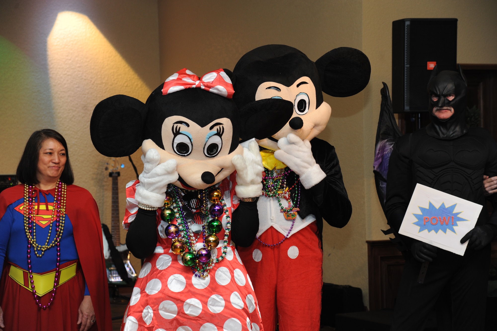 Maj. Gen. Mark Brown, 2nd Air Force commander and his wife, dressed as Mickey and Minnie Mouse, are awarded 3rd place during the costume contest during the Keesler Medical Center’s 27th annual Krewe of Medics Mardi Gras Ball Jan. 17, 2015, at the Bay Breeze Event Center, Keesler Air Force Base, Miss.  The Krewe of Medics hosts a ball every year to give military personnel assigned to the Keesler Medical Center a taste of the South and an opportunity to experience a traditional Mardi Gras.  The theme of this year's ball was TV Icons.  (U.S. Air Force photo by Kemberly Groue)