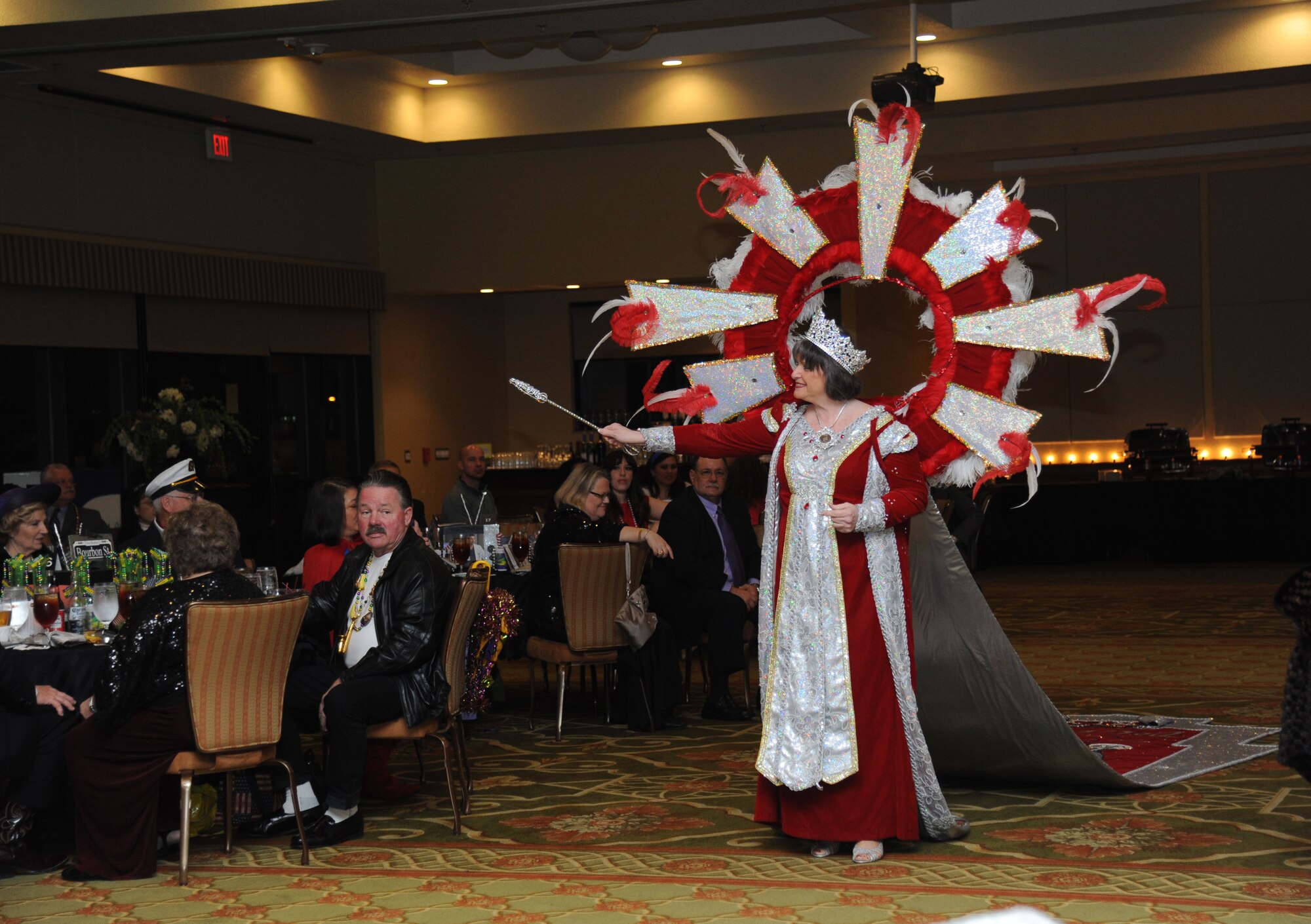 Queen Leda XLV Cecile Scialdone from the Krewe of Gemini is presented as visiting royalty from the local area during the Keesler Medical Center’s 27th annual Krewe of Medics Mardi Gras Ball Jan. 17, 2015, at the Bay Breeze Event Center, Keesler Air Force Base, Miss.  The Krewe of Medics hosts a ball every year to give military personnel assigned to the Keesler Medical Center a taste of the South and an opportunity to experience a traditional Mardi Gras.  The theme of this year's ball was TV Icons.  (U.S. Air Force photo by Kemberly Groue)