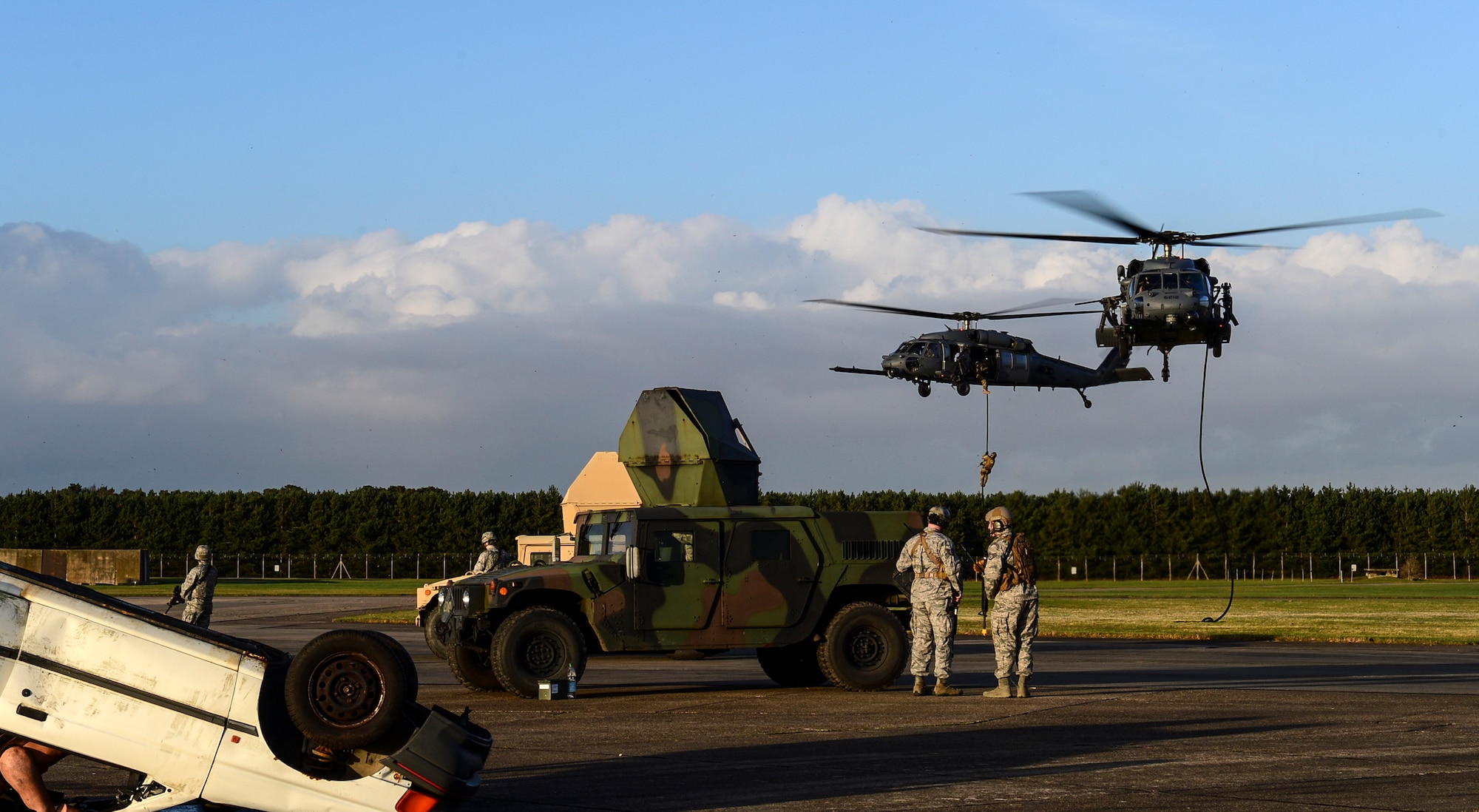 Two 56th Rescue Squadron HH-60G Pave Hawks respond in a combat search and rescue scenario at Royal Air Force Lakenheath, England, Jan. 16, 2015. The CSAR demonstration was part of an Installation Excellence Selection Board visit to determine the winner of the Commander in Chief’s Annual Award for Installation Excellence. (U.S. Air Force photo by Airman 1st Class Erin R. Babis/Released)
