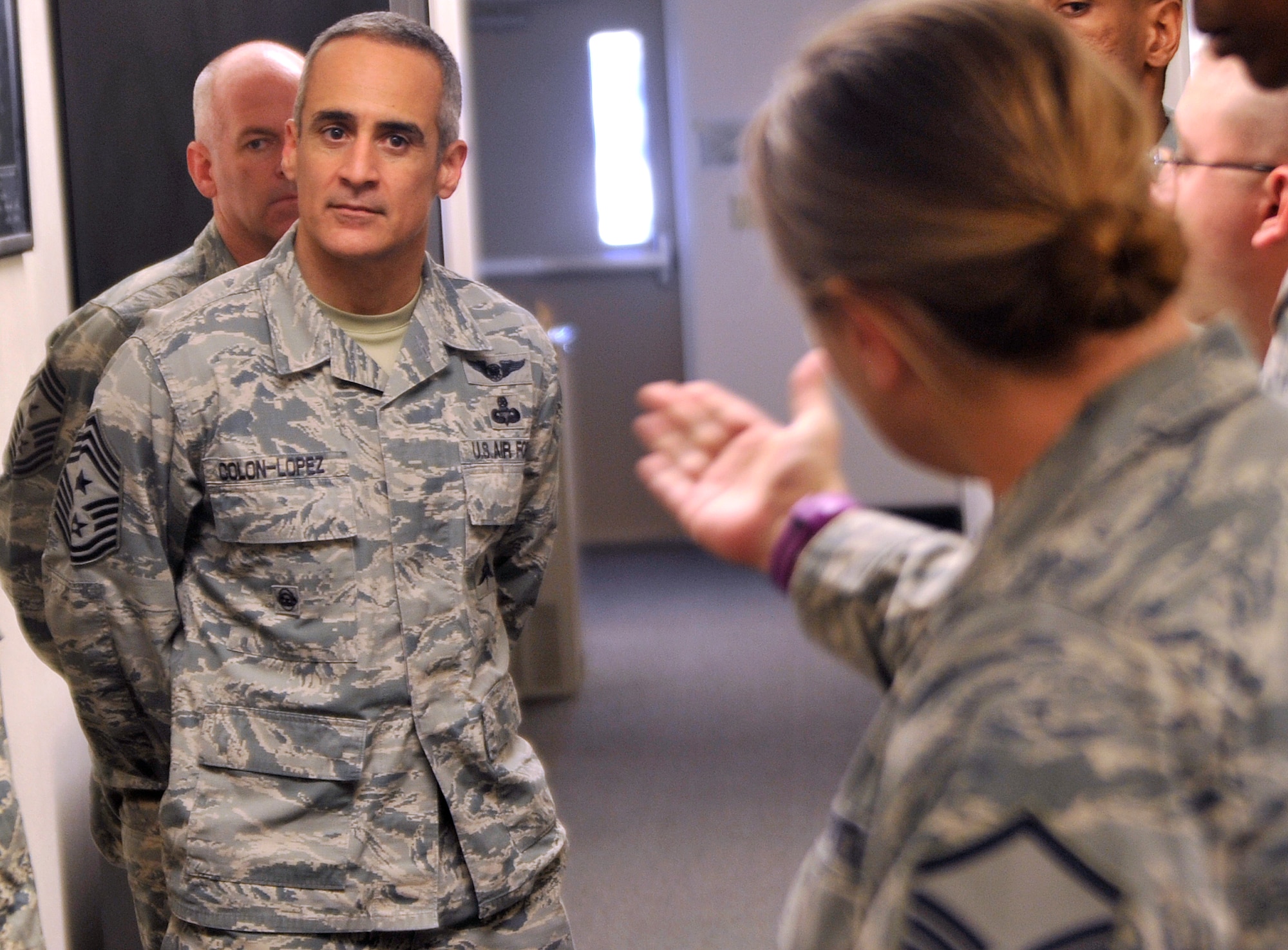 Members of the 799th Air Base Squadron ask Chief Master Sgt. Ramon Colon-Lopez, U.S. Air Forces Central Command command chief questions during his visit Jan. 15, 2015, to Creech Air Force Base, Nevada. The chief visited squadrons around the base to spend time with Airmen, answer their questions and receive feedback. (U.S. Air Force photo by Airman 1st Class Christian Clausen/Released)