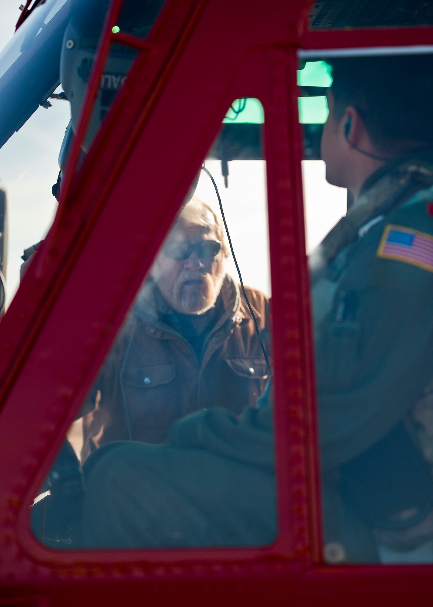 William Kelly, 96th Aircraft Maintenance Squadron, talks with the 413th Flight Test Squadron’s UH-1 Huey pilot prior to a morning sortie at Duke Field, Fla.  Civilian employees provide maintenance for the 413th’s helo test missions.  (U.S. Air Force photo/Samuel King Jr.)
