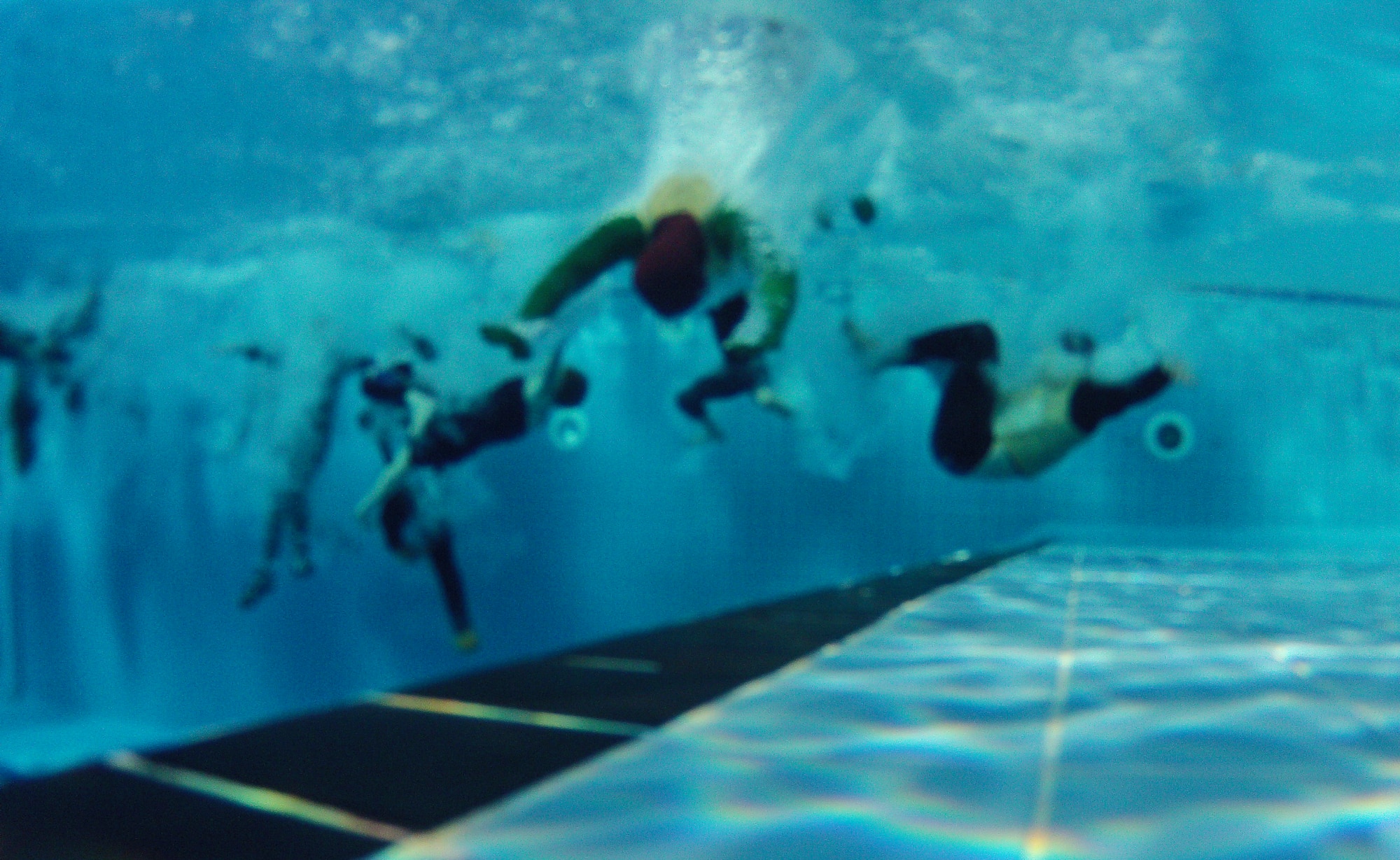 Members of Team Incirlik jump into the pool during the 2015 Polar Plunge Jan. 17, 2015, at Incirlik Air Base, Turkey. This year marks the third annual Polar Plunge. (U.S. Air Force photo by Airman Cory W. Bush/Released)