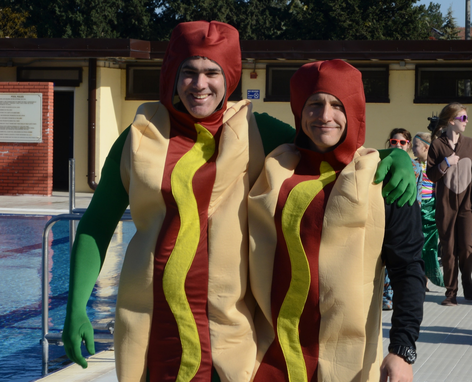 Lt. Col. Erin McDonald, 39th Communications Squadron commander, (left), and Maj. Hardy Giles, 39th Force Support Squadron commander, (right), pose for a photo during the 2015 Polar Plunge Jan. 17, 2015, at Incirlik Air Base, Turkey. Members from Incirlik dressed up in costumes to help raise base morale. (U.S. Air Force photo by Staff Sgt. Caleb Pierce/Released)