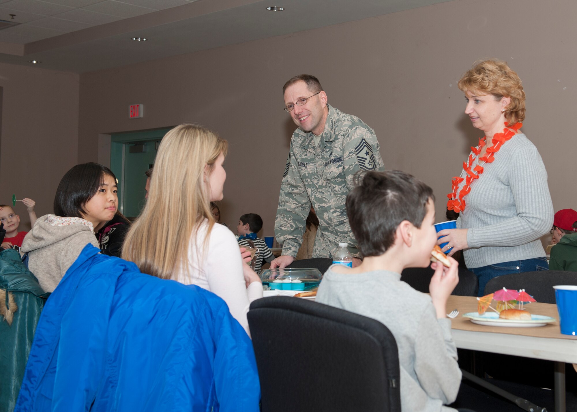 Chief Master Sgt. Stanley Cadell, 436th Airlift Wing command chief, and his wife, Rhonda Cadell, speak to families during a deployed families’ dinner Jan. 15, 2015, at the Youth Center on Dover Air Force Base, Del. These dinners are held quarterly for the families of deployed Airmen. (U.S. Air Force photo/Airman 1st Class Zachary Cacicia)