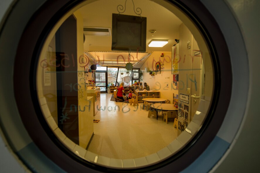 U.S. Air Force Airman 1st Class Davida Sims, a 52nd Maintenance Group commander's support staff apprentice, prepares to read to children during the second annual Dr. Martin Luther King Jr. "Reading is a Civil Right" reading drive Jan. 15, 2015, at a child development center on Spangdahlem Air Base, Germany. The base’s Airmen Against Drunk Driving council sponsored the event to read to children before the federal holiday in Dr. King’s name. (U.S. Air Force photo by Senior Airman Rusty Frank/Released)