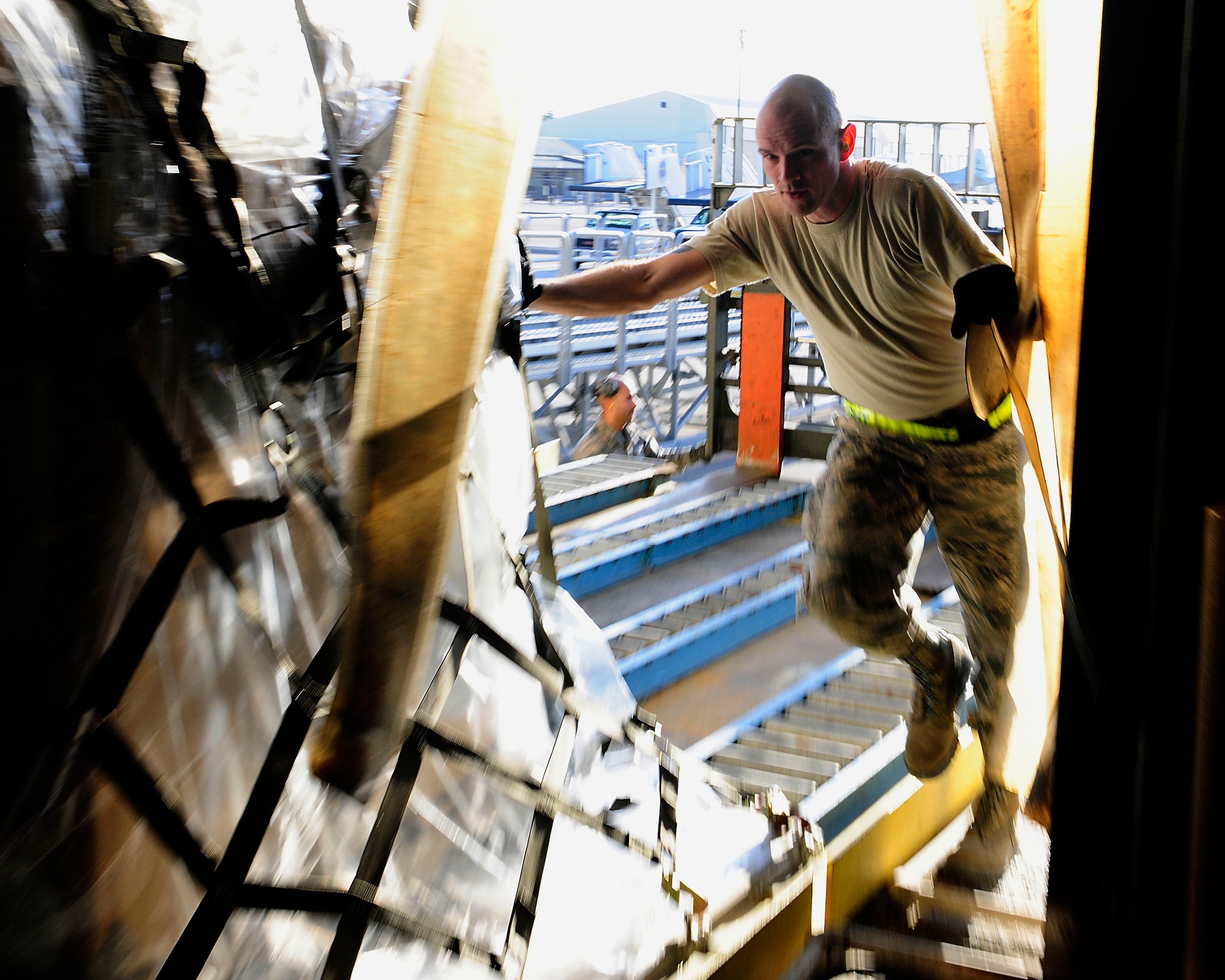 Staff Sgt. Andrew Shanahorn, 728th Air Mobility Squadron aircraft services supervisor, pushes a pallet into a warehouse Jan. 14, 2015, at Incirlik Air Base, Turkey. Shanahorn assists in processing all Incirlik cargo that uses air transportation to and from the base. (U.S. Air Force photo by Senior Airman Krystal Ardrey/Released)