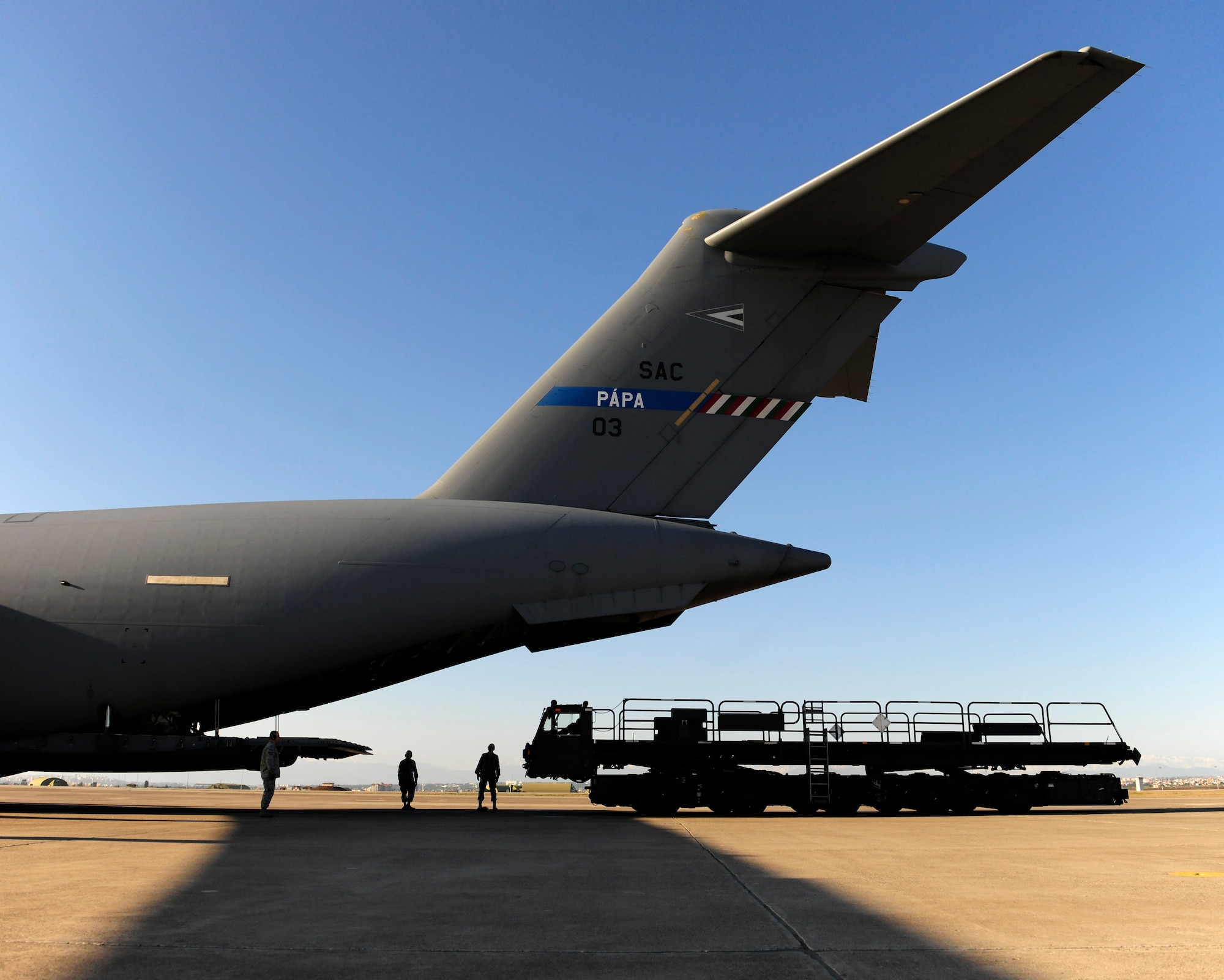 Airmen of the 728th Air Mobility Squadron aerial port flight, prepare to unload cargo from a C-17 Globemaster III Jan. 14, 2015, at Incirlik Air Base, Turkey. The 728th AMS is responsible for handling and conducting all air transportation services for flights originating from, passing through or terminating at Incirlik. (U.S. Air Force photo by Senior Airman Krystal Ardrey/Released)