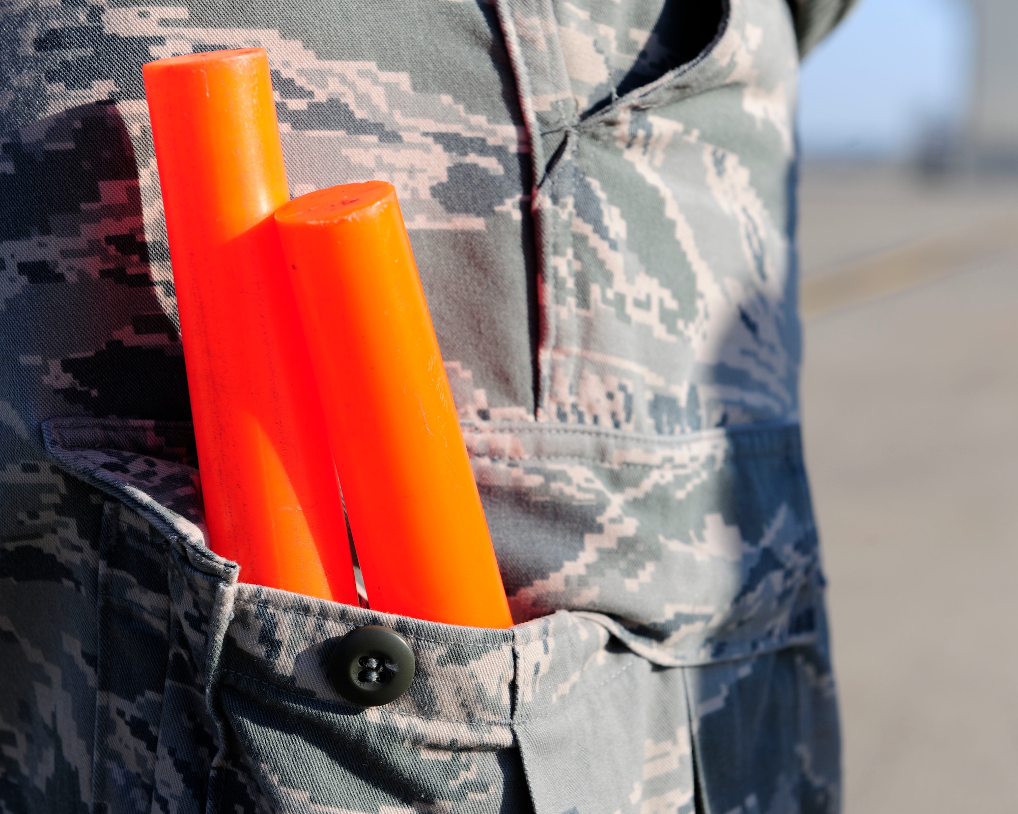Master Sgt. Robert Farrell, 446th Aircraft Maintenance Operations Squadron electronic and environmental technician, stands on the flightline Jan. 14, 2015, at Incirlik Air Base, Turkey. Farrell, who is on a temporary duty assignment with the 728th Air Mobility Squadron, provides a visual guidance to taxiing aircrafts. (U.S. Air Force photo by Senior Airman Krystal Ardrey/Released)