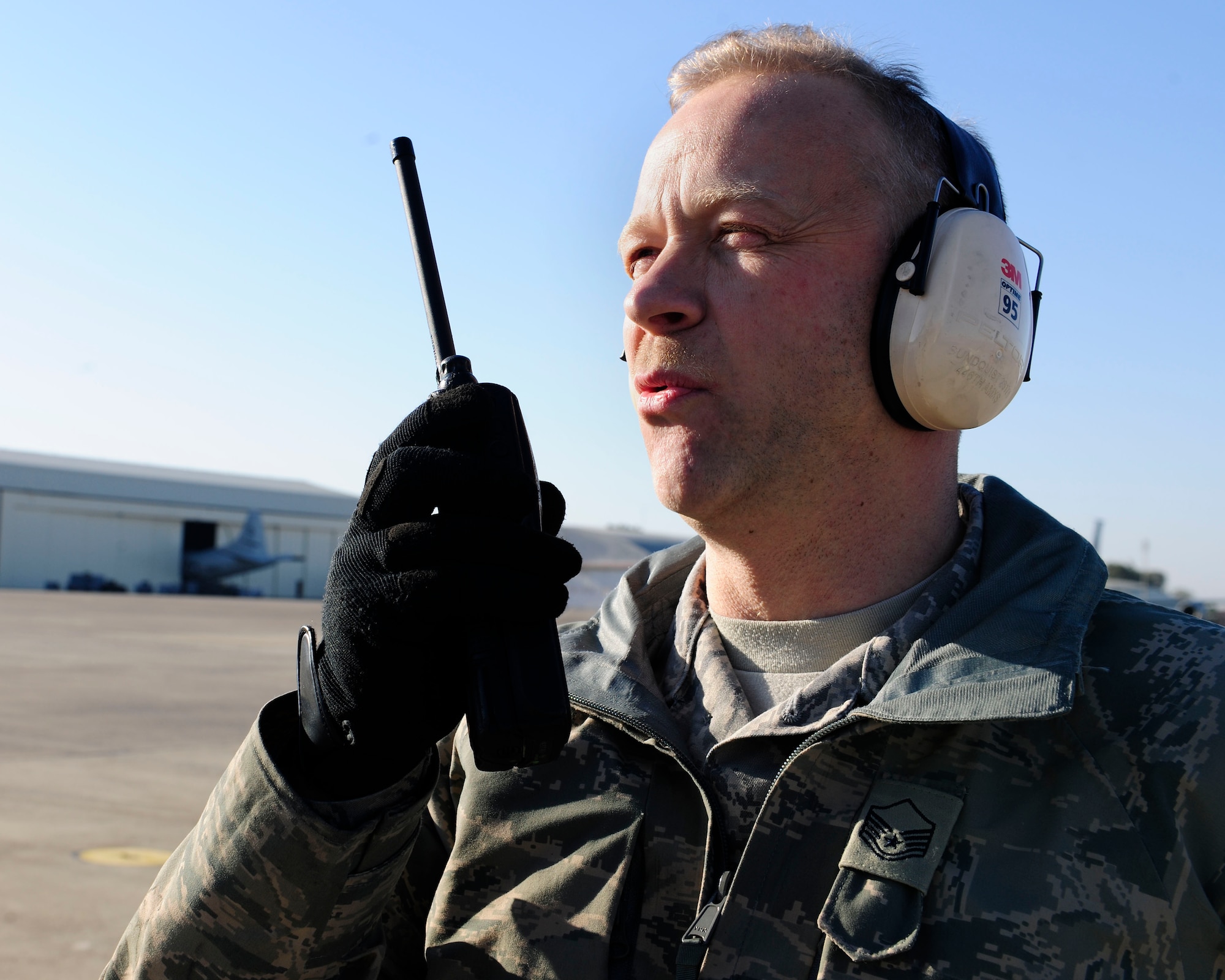 Master Sgt. Edward Sundquist, 446th Aircraft Maintenance Operations Squadron crew chief, talks to the loadmaster of a C-17 Globemaster III while preparing the aircraft for takeoff Jan. 14, 2015, at Incirlik Air Base, Turkey. Sundquist is stationed at Joint Base Lewis – McChord and on a two-week temporary duty assignment to the 728th Air Mobility Squadron. (U.S. Air Force photo by Senior Airman Krystal Ardrey/Released)