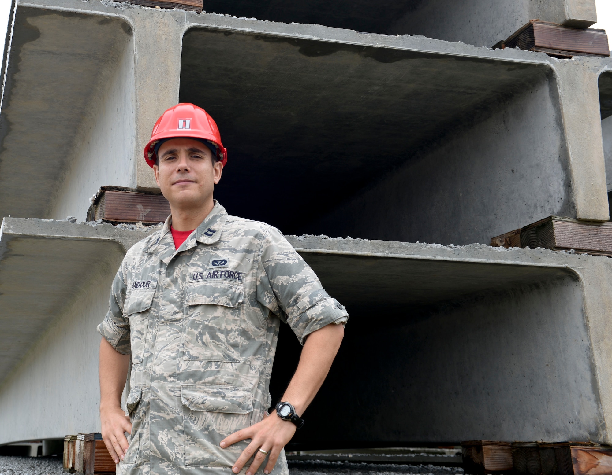 Capt. Nassem Ghandour, 554th RED HORSE Squadron Engineering Flight deputy commander, poses beside double-tee beams Jan. 16, 2015, in Yigo, Guam. Ghandour was recognized through the Every Dollar Counts program after he saved the Air Force more than $235,000. (U.S. Air Force photo by Staff Sgt. Robert Hicks/Released)