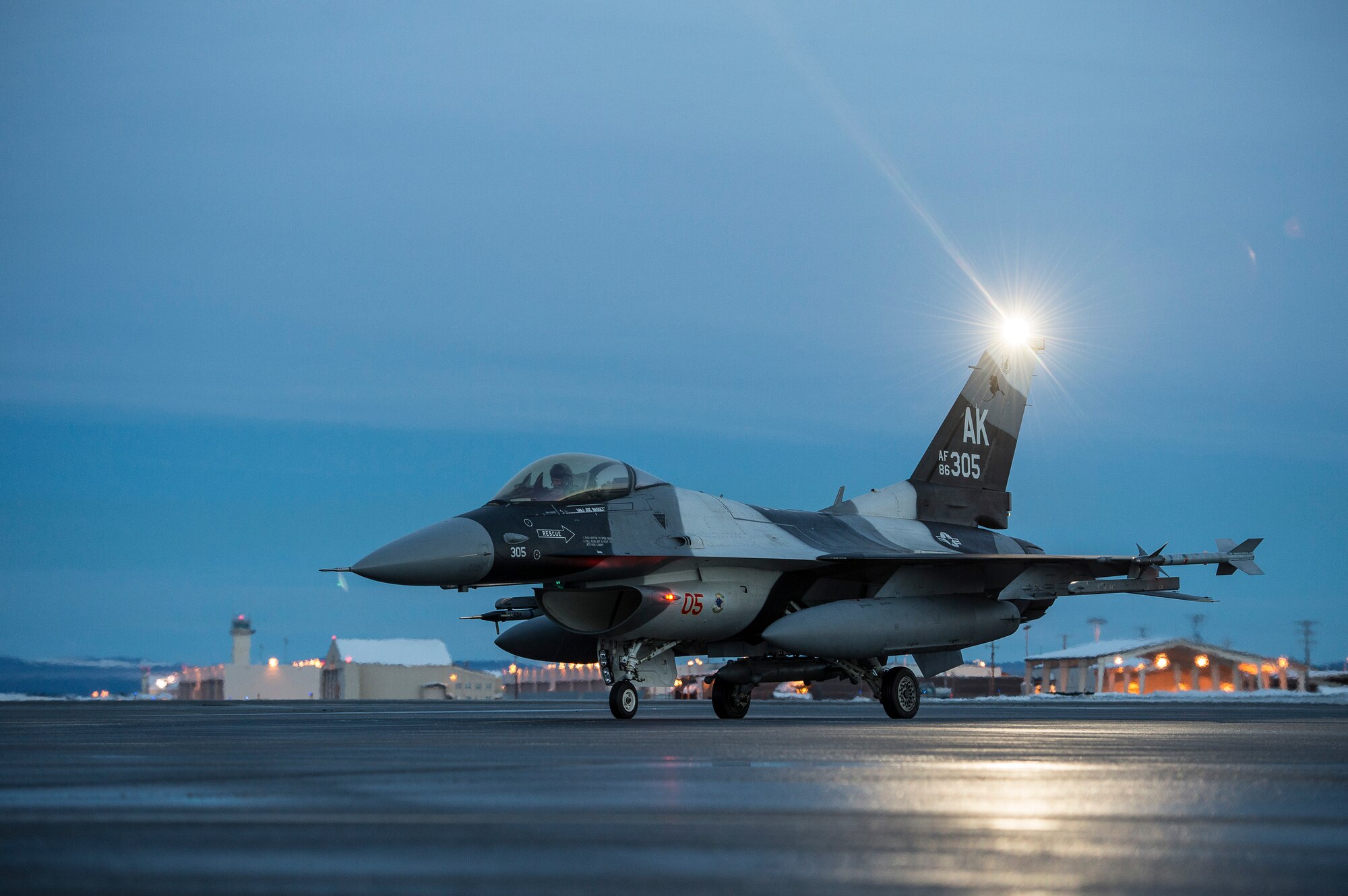 A U.S. Air Force F-16 Fighting Falcon assigned to the 18th Aggressor Squadron (AS) sits on the runway before take off from Eielson Air Force Base, Alaska, Jan. 17. 2015.  More than 150 maintainers will keep the 18th AS in the air during Pacific Air Forces exercises, which are meant to prepare U.S. Airmen, Sailors and Marines along with coalition partners in the Pacific theater of operations for contingency operations if the need arises. (U.S. Air Force photo by Senior Airman Peter Reft/Released)