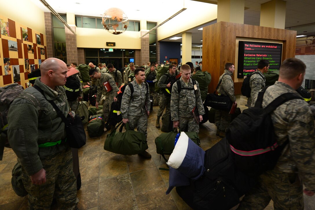 Approximately 350 Ellsworth Airmen gathered to process through a mobility line at the Deployment Center at Ellsworth Air Force Base, S.D., prior to departing for a six-month deployment to Southwest Asia Jan. 20, 2015. Aviators in support of Operation Freedom’s Sentinel and Operation Inherent Resolve will help ensure multirole airpower in the U.S. Central Command area of responsibility by providing a wide-range of capabilities including critical air presence, precision strike and surveillance and reconnaissance, as well as sortie generation and mission assurance duties. (U.S. Air Force photo by Senior Airmen Zachary Hada/Released) 