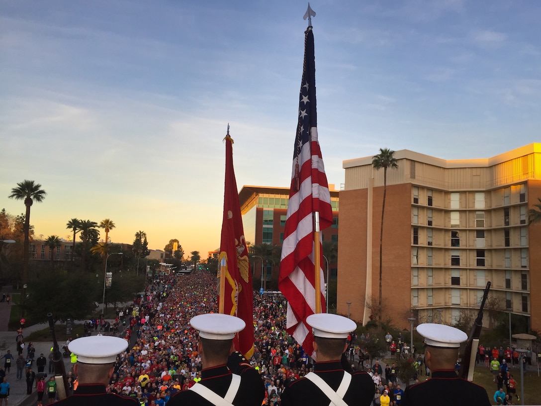 Arizona Marines from Marine Corps Recruiting Station Phoenix present the colors during the singing of the National Anthem before the start of the P.F. Changs Rock 'n' Roll Arizona Half Marathon in Tempe, Ariz. Jan. 18, 2015. More than 12,000 participants turned out for the annual run. (U.S. Marine Corps photo by Sgt. Tyler J. Bolken)