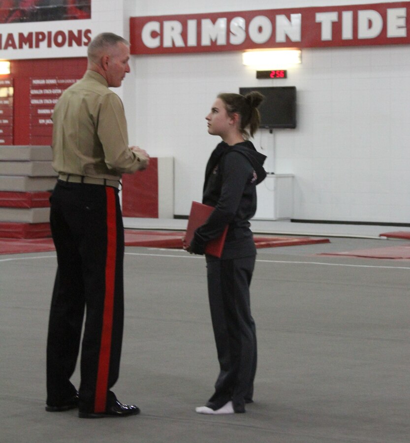 Maj. Gen. Mark Brilakis speaks to Mary Sanders about her future in the Marines as a Marine Corps officer during a surprise visit to the University of Alabama Tuesday, Jan. 20, 2015. Brilakis, the commanding general of Marine Corps Recruiting Command, recognized Sanders for her decision to serve her country as a Marine Officer and her commitment to excellence in the gym and classroom.