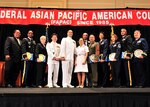 The National Guard's Army Lt. Col. Sajjan George, second from the right, who works at the Army National Guard Readiness Center in Arlington, Va., and Air Force Senior Airman Jonathan Jung Koo Bass of the California Air National Guard as well as seven other servicemembers received Military Meritorious Service Awards from the Federal Asian Pacific American Council for their contributions to the nation at the Gaylord Hotel and Convention Center in National Harbor, Md., May 6, 2010. Bass was represented by his mother, who is pictured third from the left.
