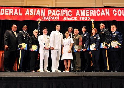 The National Guard's Army Lt. Col. Sajjan George, second from the right, who works at the Army National Guard Readiness Center in Arlington, Va., and Air Force Senior Airman Jonathan Jung Koo Bass of the California Air National Guard as well as seven other servicemembers received Military Meritorious Service Awards from the Federal Asian Pacific American Council for their contributions to the nation at the Gaylord Hotel and Convention Center in National Harbor, Md., May 6, 2010. Bass was represented by his mother, who is pictured third from the left.