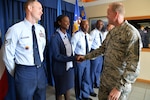 JOINT BASE PEARL HARBOR-HICKAM, Hawaii (Jan. 15, 2015) - Chief Master Sgt. of the Air Force James Cody shakes hands with Tech. Sgt. Renieka Pepper, Professional Military Education (PME) instructor, during Cody's visit to the Binnicker PME Center.  Cody shared Air Force leadership knowledge during discussions with junior and senior enlisted Airmen, and met with leadership groups and Airmen in their work areas during his two-day visit. 