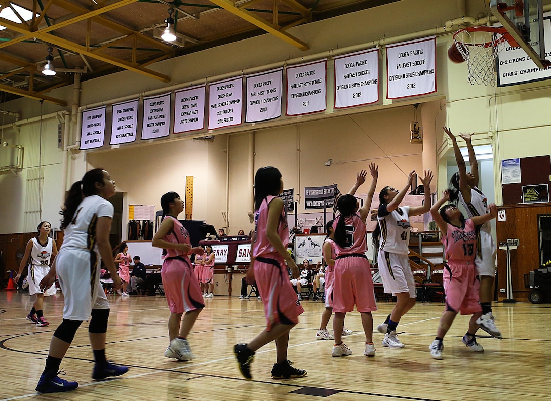 The Lady Samurai of Matthew C. Perry High School’s basketball team score against the Lady Hydrangeas of the Tabuse Agricultural-Technical High School basketball team on Jan. 18, 2015 at the high school gymnasium aboard Marine Corps Air Station Iwakuni, Japan. The Lady Samurai lost the game with a score of 24-47 and pushing forward to increase their number of wins as they stand with a 4-7 game season.