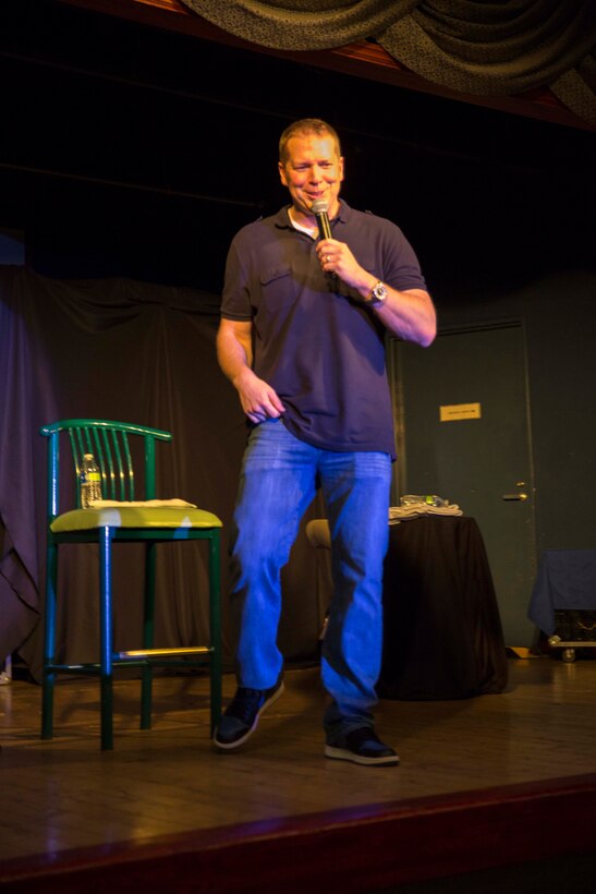 Gary Owens, a comedian, stands entertains attendees of the B4 They Made You Laugh III Marin Luther King Weekend tour hosted by Armed Forces Entertainment aboard Marine Corps Air Station Iwakuni, Japan, Jan. 16, 2015. Visiting comedians included Owens, Rodney Perry and Daniel Dugar. Owens related jokes to his prior Navy enlistment as a military policeman.