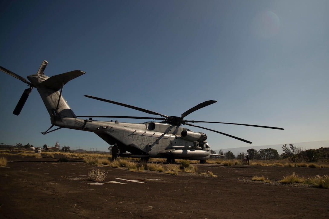 Marines with Marine Heavy Helicopter Squadron 463 board a CH-53E Super Stallion as they prepare for takeoff Jan. 14 during exercise Lava Viper 15-1.2 at Pohakuloa Training Area, Hawaii. The CH-53E Super Stallion is the largest and heaviest lift helicopter in the Marine Corps. Two CH-53Es flew on a simulated air mission. The training improves the aerial gunners’ ability to engage targets and coordinate fire between two aircraft. The aircraft is from Marine Heavy Helicopter Squadron 463, Marine Aircraft group 24, 1st Marine Aircraft Wing. 
