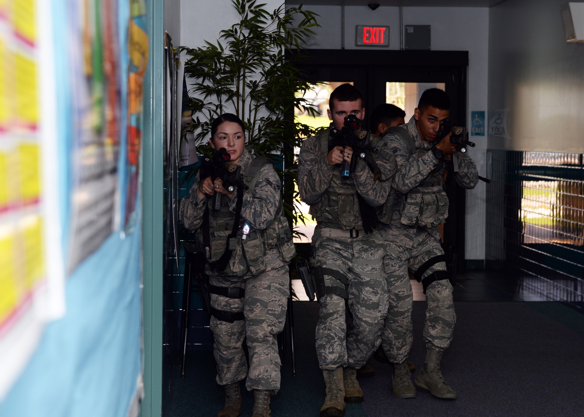 36th Security Forces Squadron Airmen practice scenarios during active shooter training at Andersen Elementary School Jan. 18, 2015, at Andersen Air Force Base, Guam. The training is designed to familiarize SFS Airmen with the school and to fine -tune their tactics in the event a real situation occurs.(U.S. Air Force photo by Senior Airman Cierra Presentado/Released)