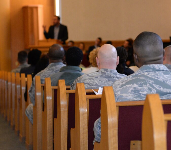 Airmen listen to the message conveyed by James McMenis, local pastor, at the Martin Luther King commemorative worship service on Barksdale Air Force Base, La., Jan. 15, 2015. More than 70 members of Team Barksdale attended to the service to honor King and his contributions to American civil rights. (U.S. Air Force photo/Airman 1st Class Curt Beach)