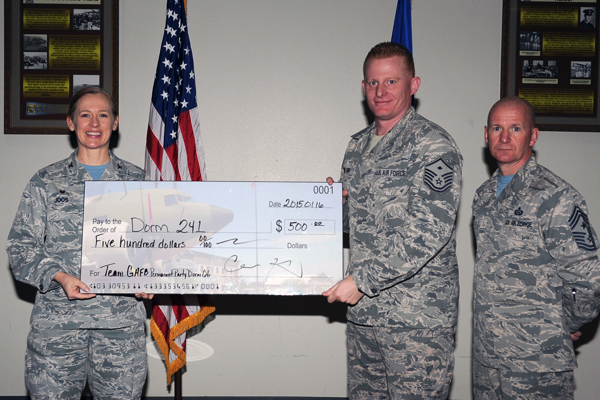 GOODFELLOW AIR FORCE BASE, Texas - Col. Kimberlee P. Joos, 17th Training Wing Commander, and Chief Master Sgt. Thomas F. Good, 17th TRW Command Chief, present Master Sgt. Brandon C. Welton, 17th Medical Group first sergeant, with the Team Goodfellow Permanent Party Dormitory of the Quarter award during the wing quarterly awards ceremony at the Event Center Jan. 16. (U.S. Air Force photo/ Staff Sgt. Laura R. McFarlane)