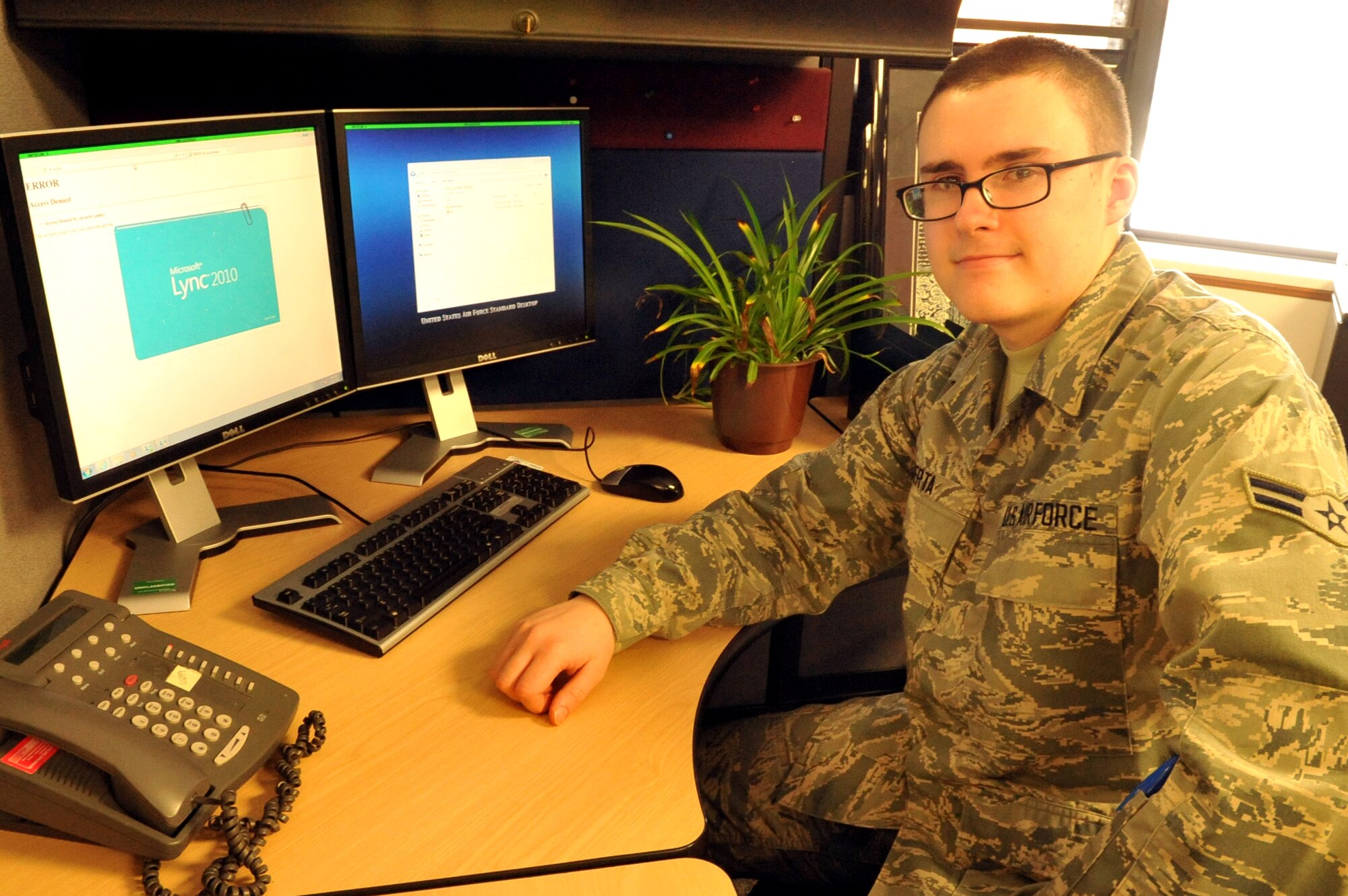 Airman 1st Class Nicholas Berta, 319th Comptroller Squadron, logs into his work station Jan. 21, 2015, on Grand Forks Air Force Base, N.D. Berta was selected as the Warrior of the Week for the fourth week of January. (U.S. Air Force photo/Staff Sgt. Susan L. Davis)