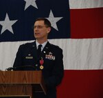 NAVAL AIR STATION FORT WORTH JOINT RESERVE BASE, Texas - Col. James Van Housen, commander of the 301st Maintenance Group, speaks to the crowd during his retirement ceremony here Jan. 11, 2015. Van Housen retired from the Air Force Reserve after 33 years of military service. (U.S. Air Force photo/Staff Sgt. Melissa Harvey)