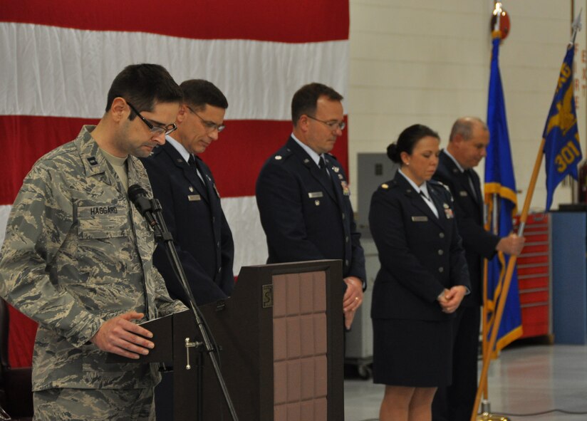 Capt. Robert Haggard, a 301st Fighter Wing chaplain, delivers the invocation at the 301st Maintenance Squadron's change of command ceremony here Jan. 10, 2015. Maj. Sarah Johnson took the squadron's rein succeeding Lt. Col. David Edwards, who recently became the maintenance group's deputy commander. (U.S. Air Force photo/Tech. Sgt. Mario Dorado)