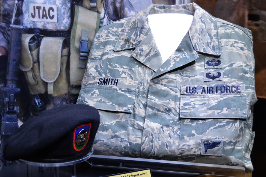 A new exhibit displaying belongings of Senior Airman Bradley Smith and Senior Airman Michael Malarsie, both of whom served as Tactical Air Control Party Airmen, is featured at the National Museum of the U.S. Air Force, Wright-Patterson Air Force Base, Ohio, Nov. 19, 2014. Smith, a native of Troy, Ill., was killed January 3, 2010, while serving in Afghanistan and was posthumously awarded the Silver Star medal, a copy of which is displayed in the lower right of the exhibit. Smith’s family and friends will attend a ceremony dedicating the exhibit officially Jan. 23, 2015. (Photo courtesy of the National Museum of the U.S. Air Force) 