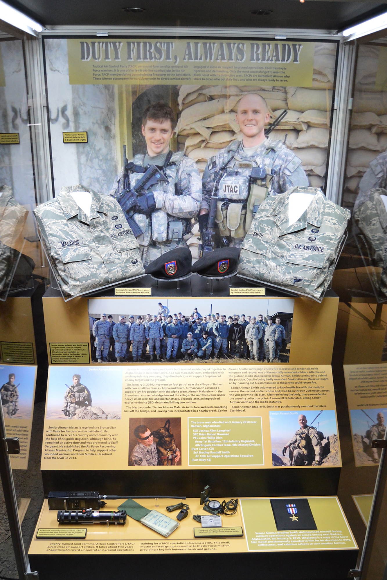 A new exhibit displaying belongings of Senior Airman Bradley Smith and Senior Airman Michael Malarsie, both of whom served as Tactical Air Control Party Airmen, is featured at the National Museum of the U.S. Air Force, Wright-Patterson Air Force Base, Ohio, Nov. 19, 2014. Smith, a native of Troy, Ill., was killed January 3, 2010, while serving in Afghanistan and was posthumously awarded the Silver Star medal, a copy of which is displayed in the lower right of the exhibit. Smith’s family and friends will attend a ceremony dedicating the exhibit officially Jan. 23, 2015. (Photo courtesy of the National Museum of the U.S. Air Force) 