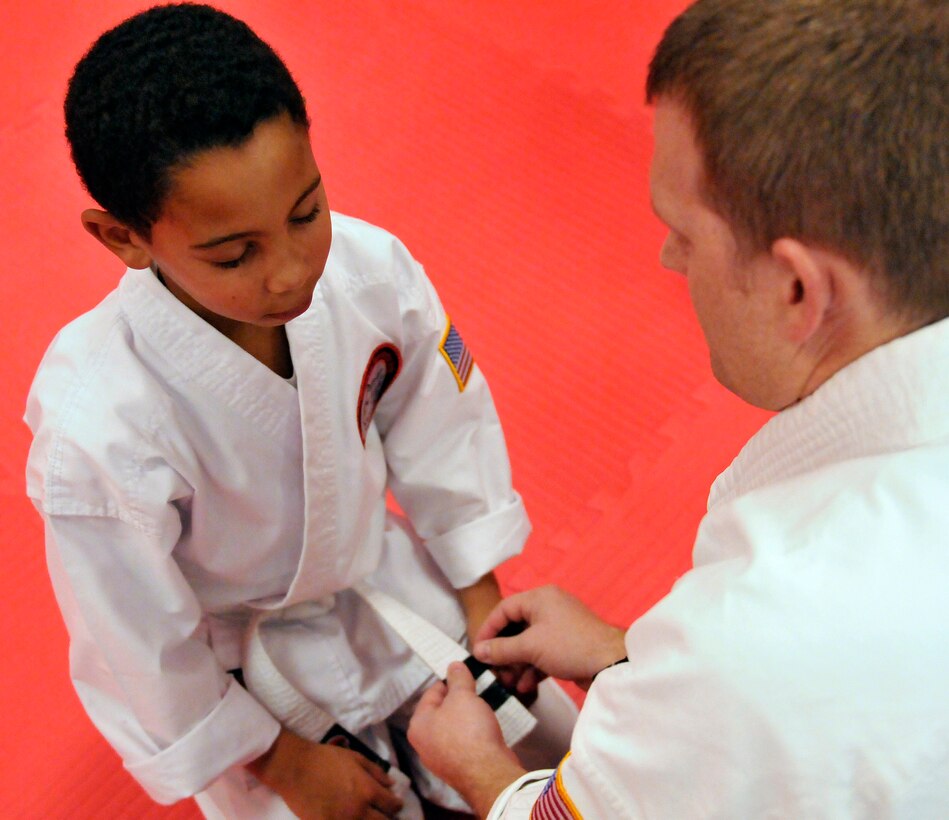 Staff Sgt. Chris Cowgill, a command post controller for the 125th Fighter Wing, leads a children's Shoalin Kempo class Jan. 9, at his studio in Orange Park, Florida. Cowgill opened the studio with his wife and business partner, and he teaches Shoalin Kempo to students of all ages during his off-duty days. (U.S. Air National Guard photo by Tech. Sgt. William Buchanan/ Released)
 