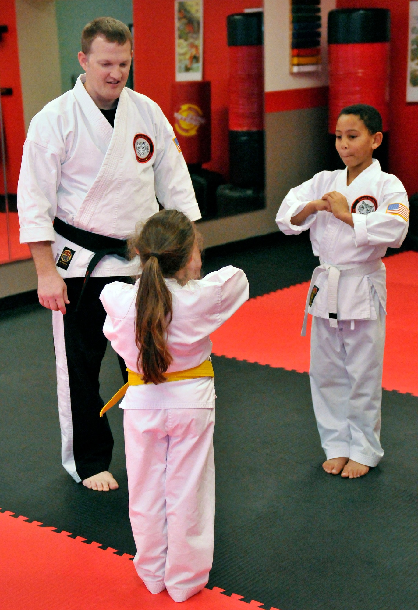 Staff Sgt. Chris Cowgill, a command post controller for the 125th Fighter Wing, leads a children's Shoalin Kempo class Jan. 9, at his studio in Orange Park, Florida. Cowgill opened the studio with his wife and business partner, and he teaches Shoalin Kempo to students of all ages during his off-duty days. (U.S. Air National Guard photo by Tech. Sgt. William Buchanan/ Released)
 
