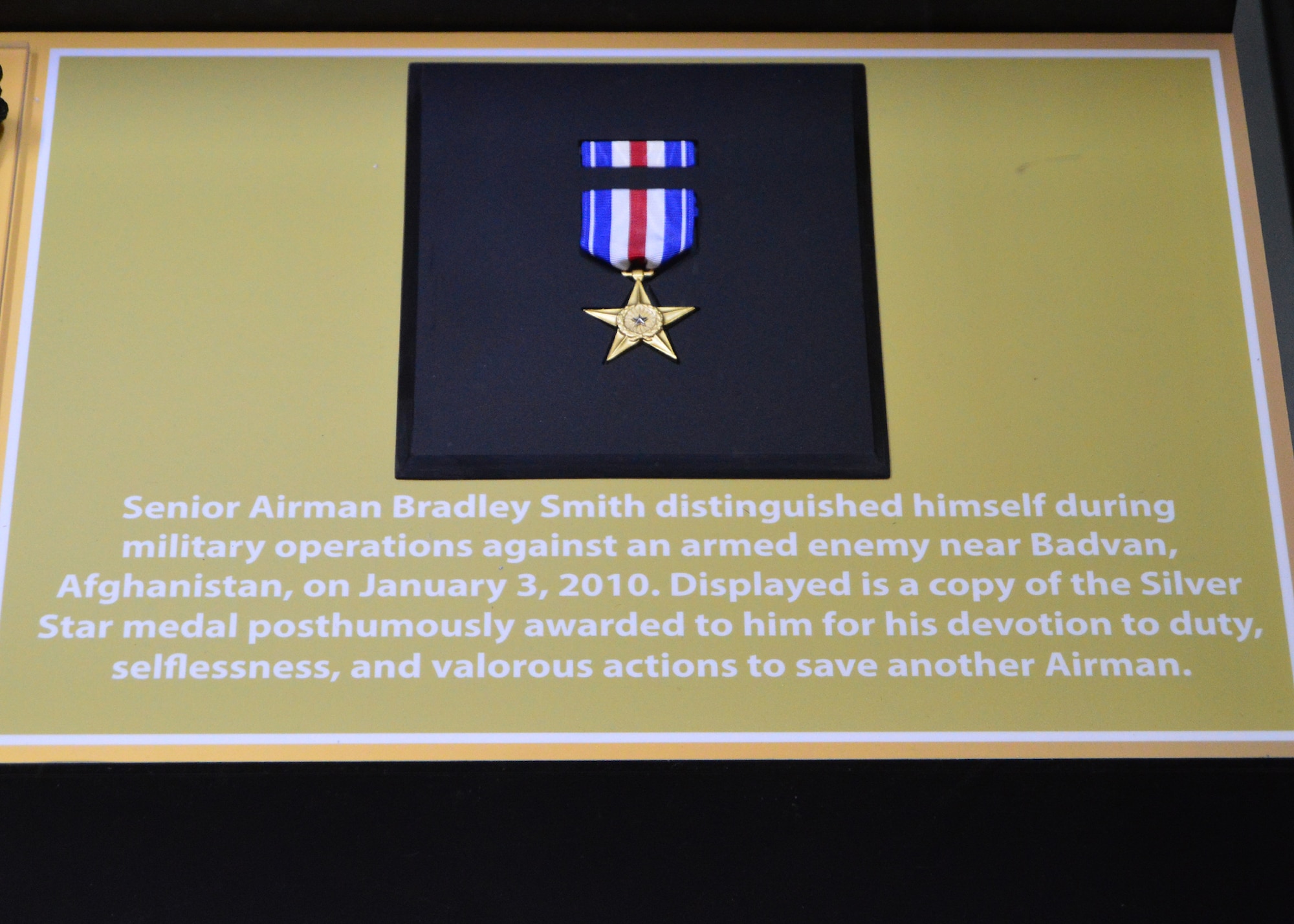 DAYTON, Ohio -- The "Duty First, Always Ready" exhibit, located in the Cold War Gallery at the National Museum of the U.S. Air Force, highlights the service of Senior Airmen Michael Malarsie and Bradley Smith, a two-man Joint Terminal Attack Controller (JTAC) who deployed together to Afghanistan in December 2009. Here is a copy of the Silver Star medal posthumously awarded to Senior Airman Smith. (U.S. Air Force photo)
